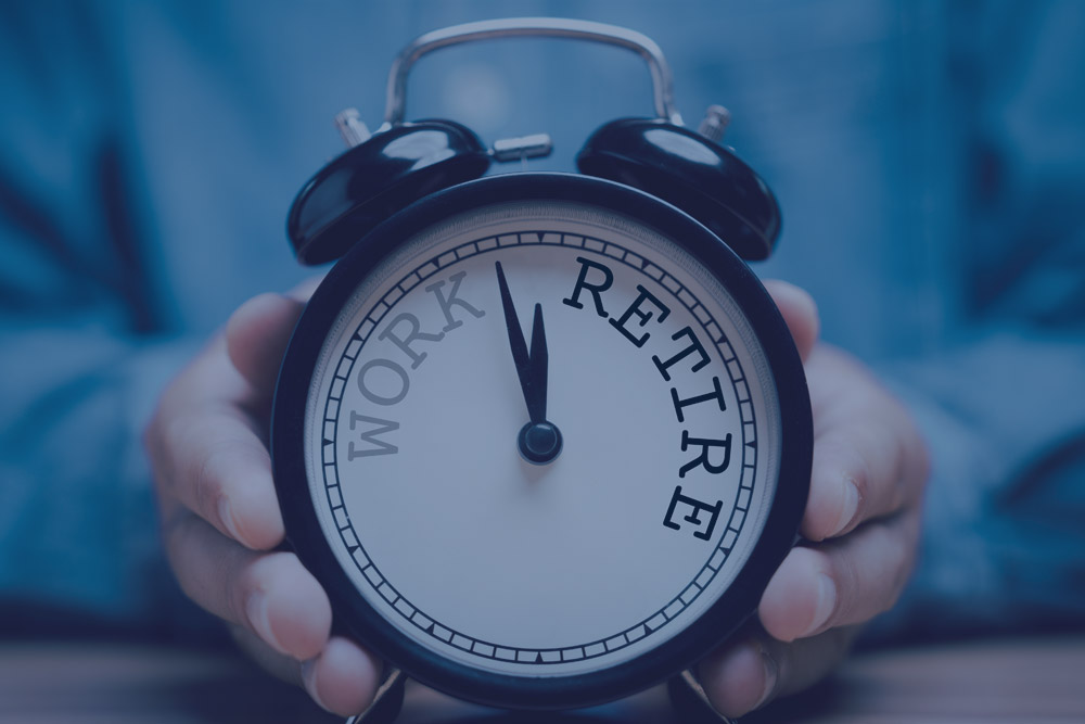 Clock with writing saying work or retire
