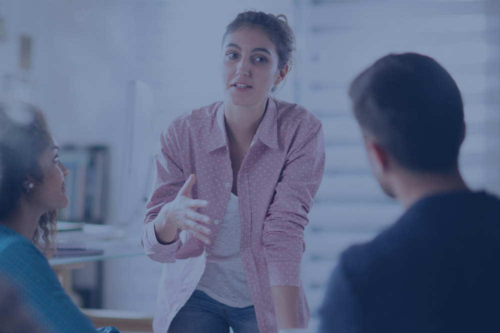 Lady speaking to colleagues